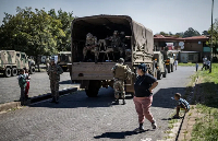 Resident reacts during a police and military operation in Westbury