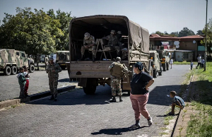 Resident reacts during a police and military operation in Westbury Resident reacts during a police and military operation in Westbury
