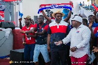 Matthew Opoku Prempeh, Manhyia South MP in cowboy hat with some party youth | File photo