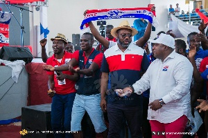 Matthew Opoku Prempeh, Manhyia South MP in cowboy hat with some party youth | File photo