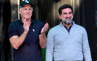 Greg Norman applauds Yasir Al-Rumayyan at LIV Golf Chicago