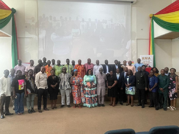 Some of the policymakers, civil society actors and tax experts in a photograph at the event
