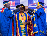 Prof Naana Opoku-Agyemang (M) being decorated by Sir Sam (L) and William Atuguba, fmr SC judge