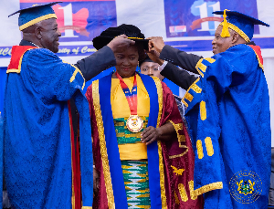 Prof Naana Opoku-Agyemang (M) being decorated by Sir Sam (L) and William Atuguba, fmr SC judge