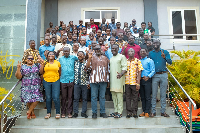 Participants in a group picture at the College of Engineering and Industry Symposium