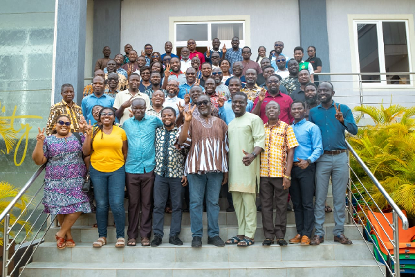 Participants in a group picture at the College of Engineering and Industry Symposium