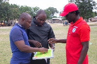 A photo of  two participating coaches and Coach Paul Dzaka (instructor)
