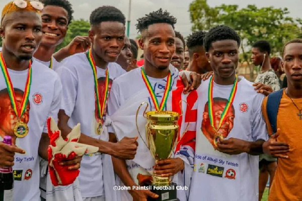 John Paintsil FC players wearing white shirts displaying Alhaji Sly Tetteh's image