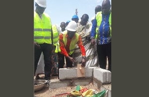 Kwaku Ofori Asiamah laying blocks for the commencement of the project