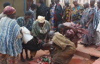 The executioners and linguists slaughtering a sheep to perform the rites