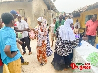 Dr Grace Ayensu-Danquah is seen here sharing some of the food to some constituents