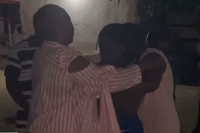 Phillis Naa Koryoo Okunor consoling some of the family members of one of the deceased