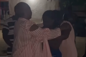 Phillis Naa Koryoo Okunor consoling some of the family members of one of the deceased