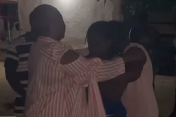 Phillis Naa Koryoo Okunor consoling some of the family members of one of the deceased