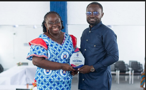 Mr. Osafo-Ampomah receiving an award from the school's headmistress