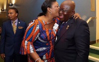 The president could be seen beaming with excitement as his wife planted the kiss on his cheeks
