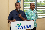 Reverend Martin Amenaki, Ketu North Municipal Chief Executive commending NHIS