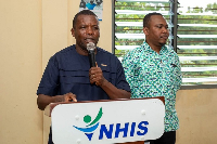Reverend Martin Amenaki, Ketu North Municipal Chief Executive commending NHIS