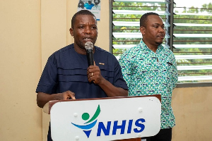 Reverend Martin Amenaki, Ketu North Municipal Chief Executive commending NHIS