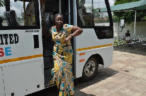 Matilda Amissah-Arthur posed by the donated bus