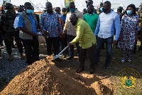 President Akufo-Addo cutting the sod for the construction of the road