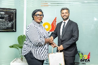 Dr Mary Awusi and Mehet Tüzun exchanging pleasantries