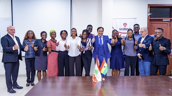 Beneficiaries in a pose with the ambassador