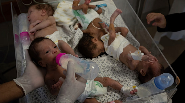 Medics prepare premature babies for transport to Egypt after they were evacuated from Shifa Hospital