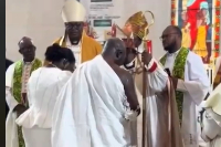 The priest appears to be dazed after touching Otumfuo to pray for him