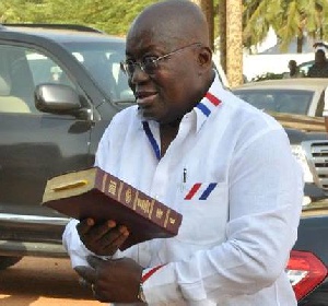 File photo: President Akufo-Addo holding a Bible