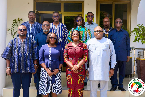 Obuobia Darko-Opoku (M) in a group photo with members of the committee