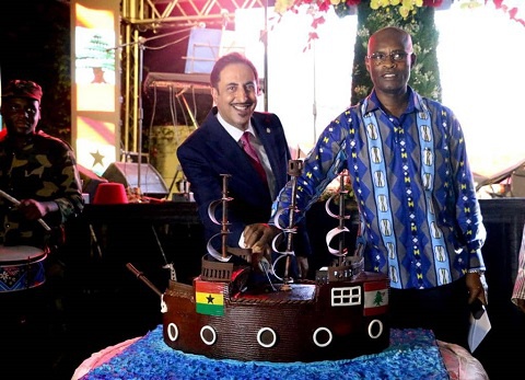 The Lebanese ambassador (L) and an official from the Foreign Affairs ministry cutting the cake