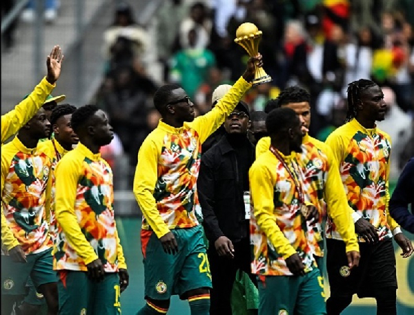 Senegal players showcased the AFCON trophy in a friendly match