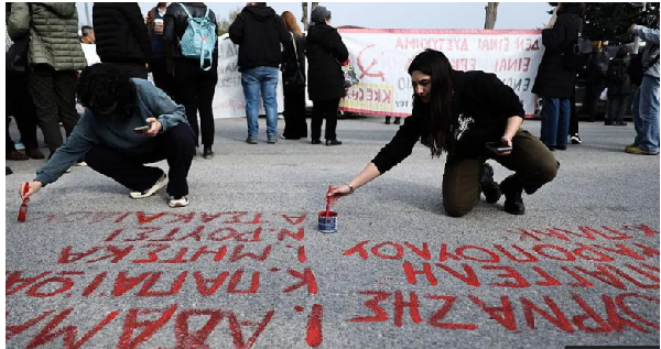 Victims' names are painted on the ground outside the courthouse