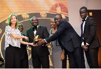 Directors and staff of the Microfin Rural Bank (MRB) receiving an award at the Ghana Business Award