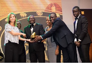 Directors and staff of the Microfin Rural Bank (MRB) receiving an award at the Ghana Business Award