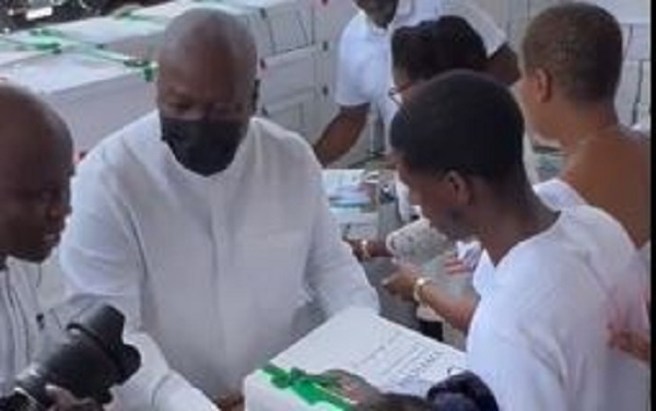 President-elect John Dramani Mahama distributing food to church members