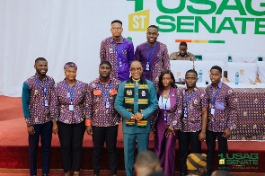 Most Rev. Samuel Noi Mensah surrounded by USAG executives