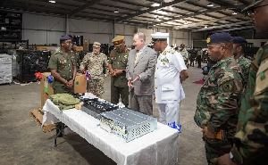 Rear Admiral Godwin Livinus Bessing (in White)