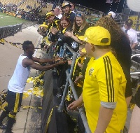 Harrison Afful giving away his jersey