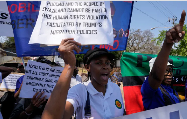 Eswatini pro-democracy activists hold placards during a protest outside the US Embassy in Pretoria