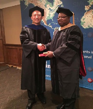 Dr Kofi Mensah receives his award
