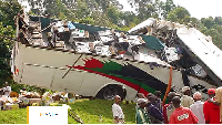 Wreckage of a regional bus after it overturned and killed at least 30 passengers