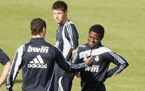 Daniel Opare (right) in a handshake with Cristiano Ronaldo