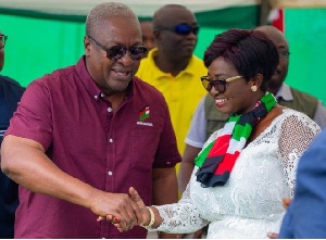 Maame Efua (L) shaking hands with former president Mahama