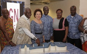 Papa Kwesi Nduom with some members of Groupe Nduom cut cake to inaugurate GNTV UK channel