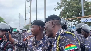 IGP Dr George Akuffo Dampare sharing selfie moment with some police personnel