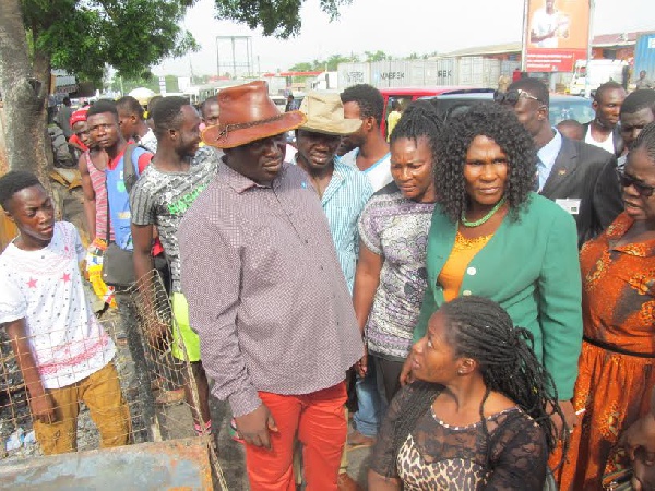 Ablekuma MP, Akua Afiriyie and NADMO Coordinator Cobbina Archibald  withthe fire victims