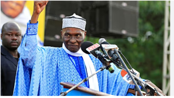 Abdoulaye Wade gestures as he addresses his supporters at a rally in Dakar