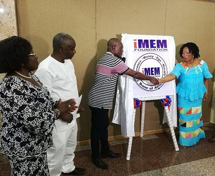 Mrs Comfort Aniagyei (R), director of iMEM foundation in a handshake with Lawyer Abraham Osei-Aidoo